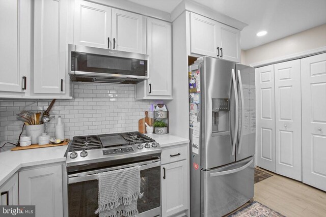 4102 Chris Shan Ct, Fredericksburg, VA 22408 - kitchen with appliances with stainless steel finishes, light countertops, backsplash, white cabinets, and recessed lighting