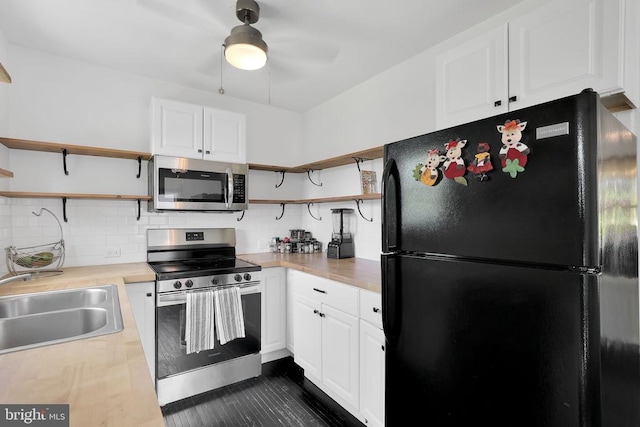 316 Wayland Rd, Culpeper, VA 22701 - kitchen featuring appliances with stainless steel finishes, open shelves, light countertops, and tasteful backsplash