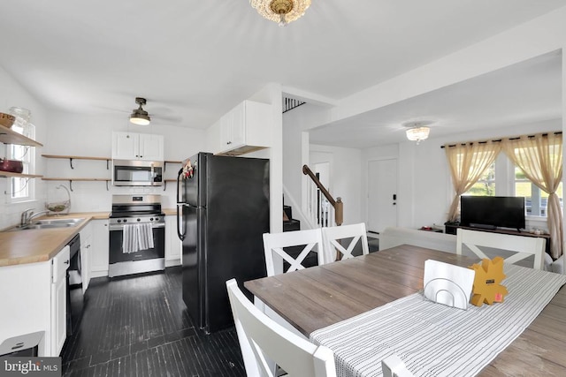 316 Wayland Rd, Culpeper, VA 22701 - kitchen featuring appliances with stainless steel finishes, open shelves, white cabinets, ceiling fan, and light countertops