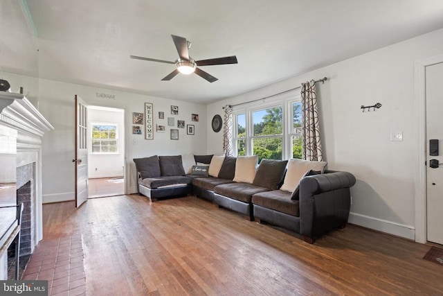 130 Morningside Dr, Culpeper, VA 22701 - living area featuring a brick fireplace, a ceiling fan, plenty of natural light, and wood finished floors