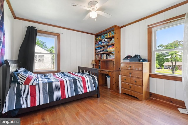 130 Morningside Dr, Culpeper, VA 22701 - bedroom with ornamental molding, wood finished floors, ceiling fan, and a decorative wall