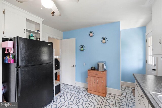 130 Morningside Dr, Culpeper, VA 22701 - kitchen with freestanding refrigerator, white cabinets, ceiling fan, and light tile patterned floors