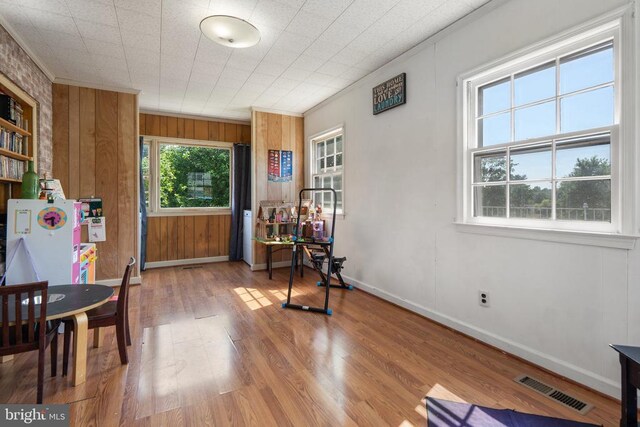 130 Morningside Dr, Culpeper, VA 22701 - living area featuring wood finished floors, wooden walls, and crown molding