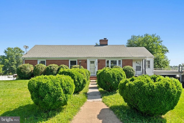 130 Morningside Dr, Culpeper, VA 22701 - view of front of home with a chimney, a front yard, and brick siding