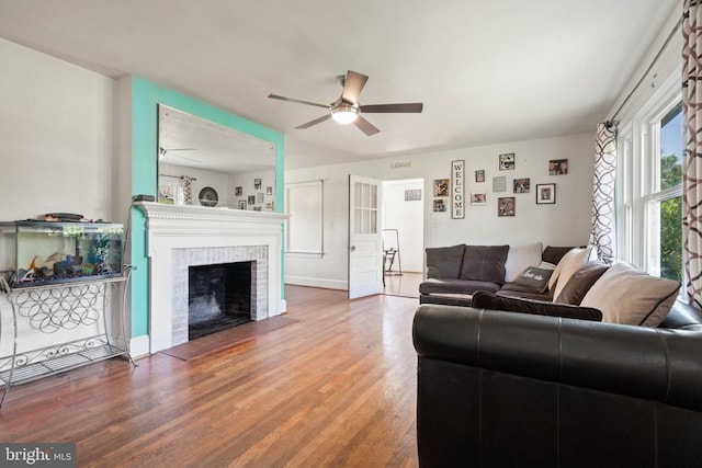 130 Morningside Dr, Culpeper, VA 22701 - living area featuring ceiling fan, a tiled fireplace, and wood finished floors