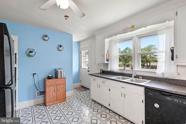 130 Morningside Dr, Culpeper, VA 22701 - kitchen featuring dishwasher, dark countertops, and white cabinets