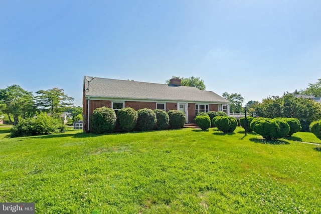 130 Morningside Dr, Culpeper, VA 22701 - view of front of property featuring a front lawn, a chimney, and brick siding