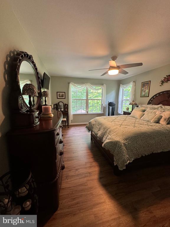 514 Constitution Blvd, Locust Grove, VA 22508 - bedroom with dark wood finished floors and a ceiling fan