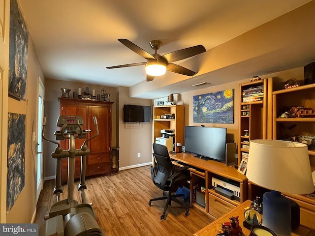 office space with wood finished floors, ceiling fan, and baseboards