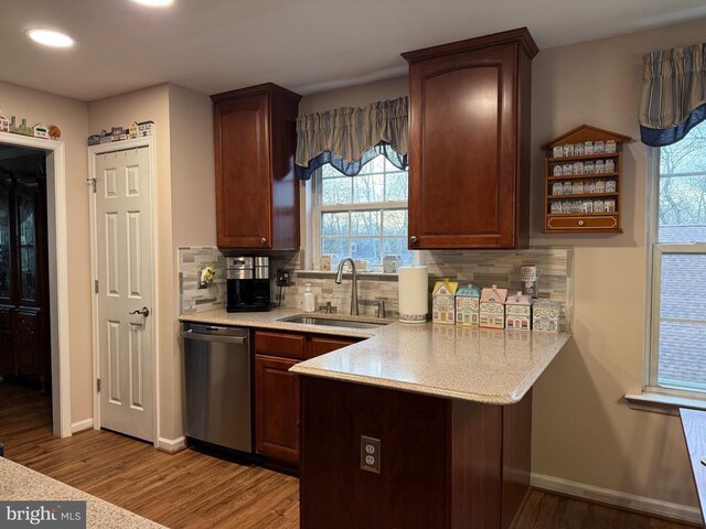 514 Constitution Blvd, Locust Grove, VA 22508 - kitchen featuring stainless steel dishwasher, a sink, a peninsula, light wood-style floors, and healthy amount of natural light
