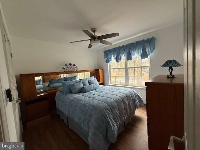 bedroom with wood finished floors and a ceiling fan