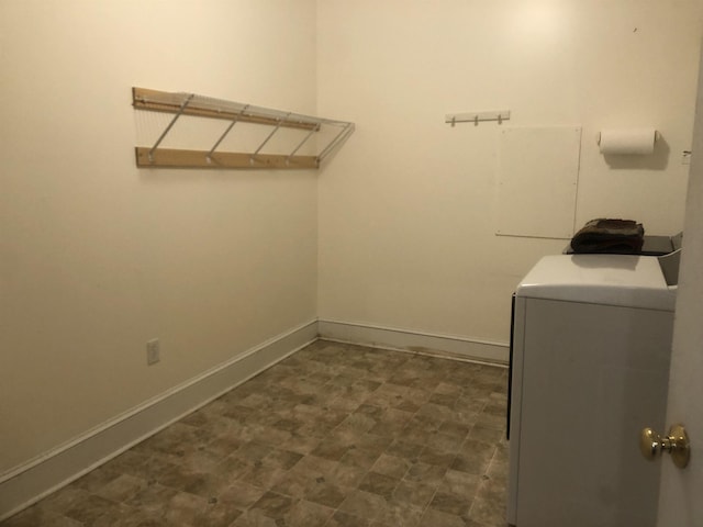 washroom with washer / clothes dryer