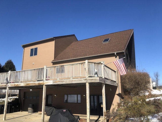 back of property with a carport