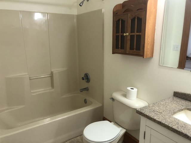 full bathroom featuring vanity, bathtub / shower combination, and toilet