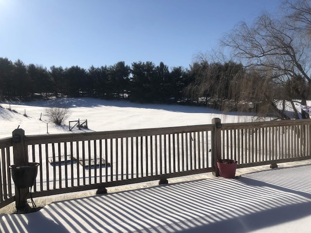 view of snow covered deck