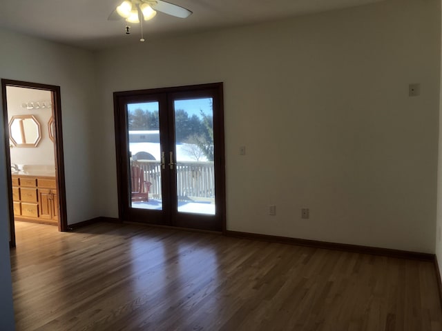 unfurnished room with french doors, ceiling fan, and dark hardwood / wood-style floors