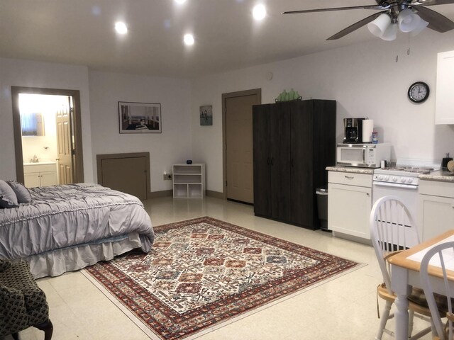 bedroom featuring ensuite bathroom and ceiling fan