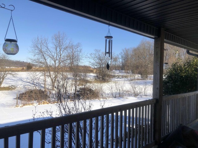 view of snow covered deck