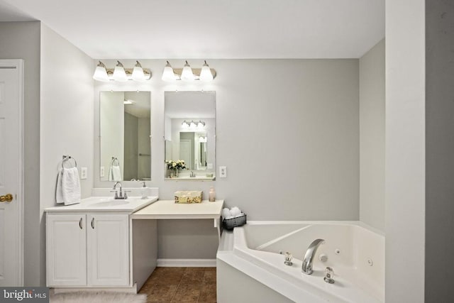  - bathroom featuring vanity and a jetted tub