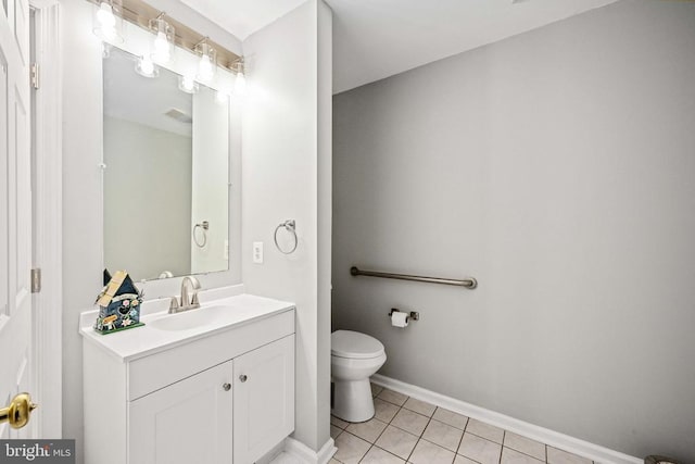 - bathroom featuring tile patterned flooring, vanity, toilet, and baseboards
