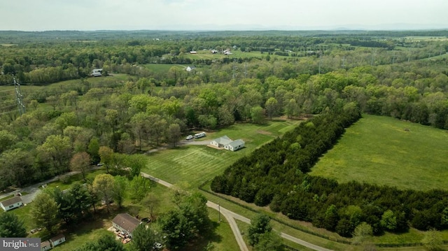  - view of property location featuring a heavily wooded area and rural landscape