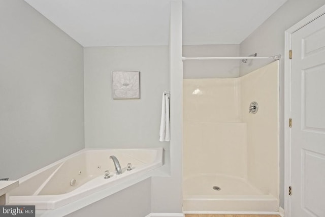  - full bathroom featuring a stall shower and a jetted tub