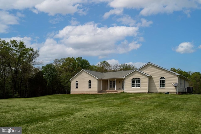  - view of front facade with a front yard and covered porch