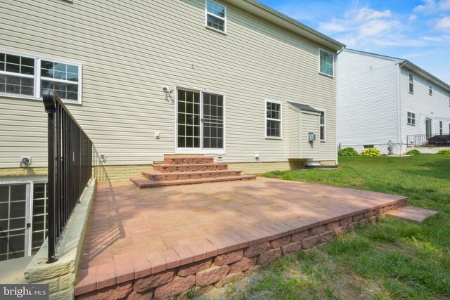 2042 Mourning Dove Dr, Locust Grove, VA 22508 - back of property with entry steps, a yard, and a patio