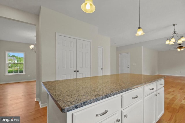 2042 Mourning Dove Dr, Locust Grove, VA 22508 - kitchen featuring a chandelier, open floor plan, and dark stone counters