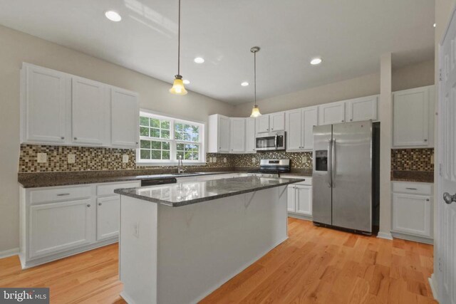 2042 Mourning Dove Dr, Locust Grove, VA 22508 - unfurnished living room with a fireplace with flush hearth, ceiling fan, and light wood finished floors