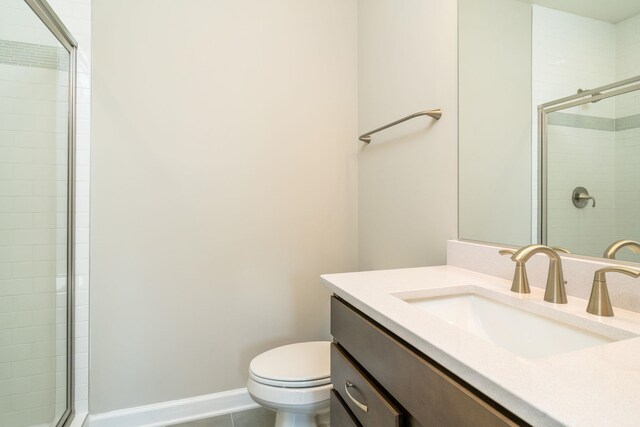 3499 Monterey Dr Unit 34F, Rockingham, VA 22801 - bathroom with a tile shower, toilet, vanity, tile patterned flooring, and baseboards