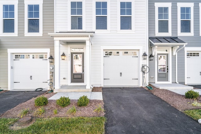 3499 Monterey Dr Unit 34F, Rockingham, VA 22801 - view of front of house featuring a standing seam roof, asphalt driveway, metal roof, and an attached garage