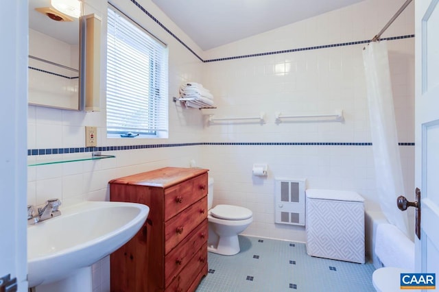 3 Old Mill Rd, Warm Springs, VA 24484 - full bathroom with heating unit, toilet, a sink, tile walls, and tile patterned flooring