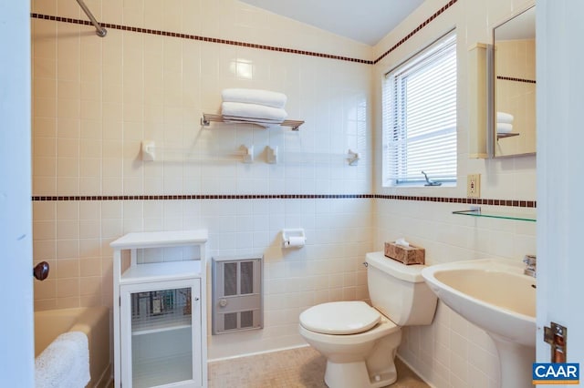 3 Old Mill Rd, Warm Springs, VA 24484 - bathroom with heating unit, toilet, a sink, tile walls, and a washtub