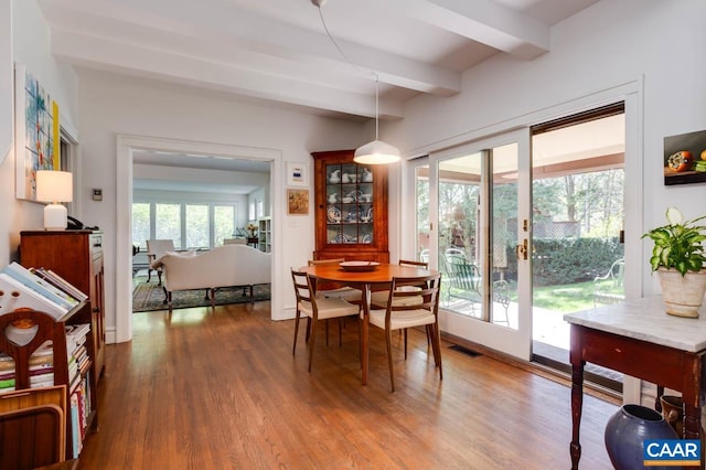 3 Old Mill Rd, Warm Springs, VA 24484 - dining area featuring beam ceiling, visible vents, and wood finished floors