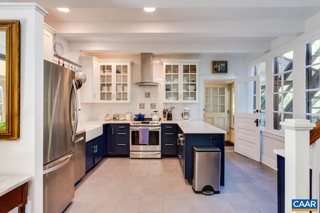3 Old Mill Rd, Warm Springs, VA 24484 - kitchen with recessed lighting, white cabinetry, wall chimney exhaust hood, blue cabinetry, and stainless steel appliances