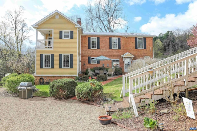 325 Union Run, Lexington, VA 24450 - back of property featuring a balcony, a chimney, and brick siding