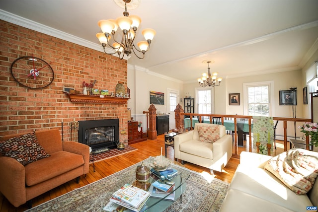325 Union Run, Lexington, VA 24450 - living area with a chandelier, wood finished floors, a brick fireplace, crown molding, and a baseboard heating unit