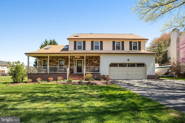 11911 Smoketree Blvd, Fredericksburg, VA 22407 - view of front of house featuring driveway, a garage, stone siding, a porch, and a front lawn