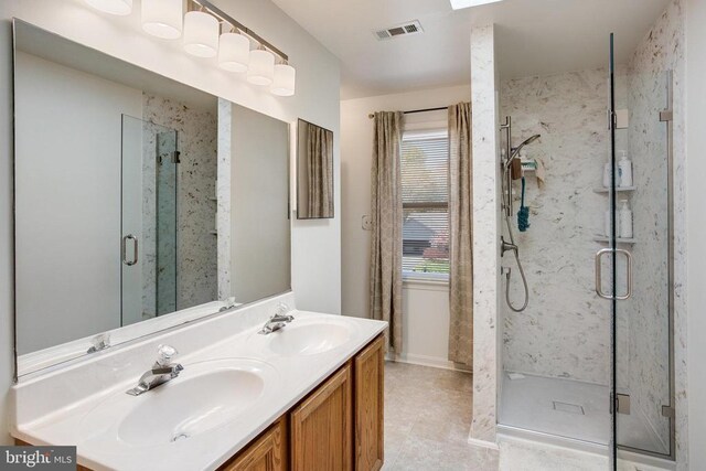 11911 Smoketree Blvd, Fredericksburg, VA 22407 - bathroom featuring a sink, plenty of natural light, a marble finish shower, and visible vents