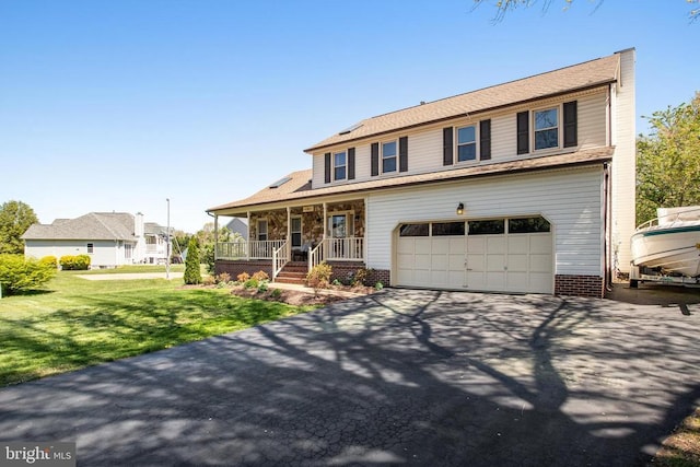 11911 Smoketree Blvd, Fredericksburg, VA 22407 - view of front of home with a porch, aphalt driveway, an attached garage, and a front lawn