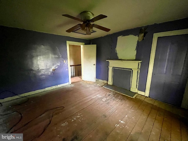 120 Charles St, Gordonsville, VA 22942 - unfurnished living room with hardwood / wood-style floors, ceiling fan, baseboards, and a fireplace