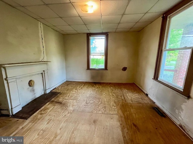 120 Charles St, Gordonsville, VA 22942 - unfurnished living room with hardwood / wood-style floors, a drop ceiling, and baseboards