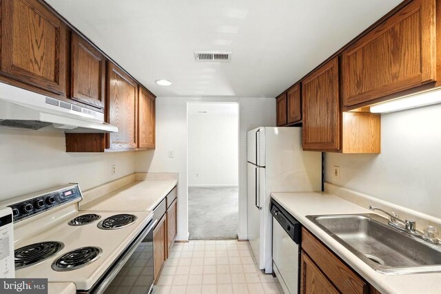7637 Wankoma Dr, Remington, VA 22734 - kitchen with white appliances, under cabinet range hood, and light countertops