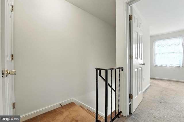 7637 Wankoma Dr, Remington, VA 22734 - hallway with an upstairs landing and carpet flooring