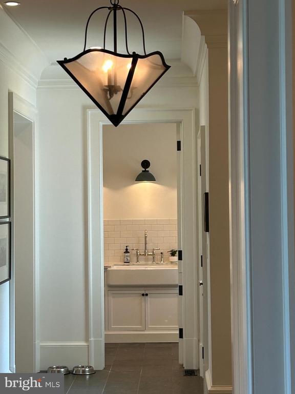  - bathroom featuring ornamental molding, tile patterned floors, and vanity