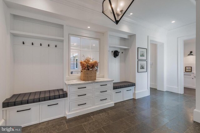mudroom with baseboards, ornamental molding, and recessed lighting