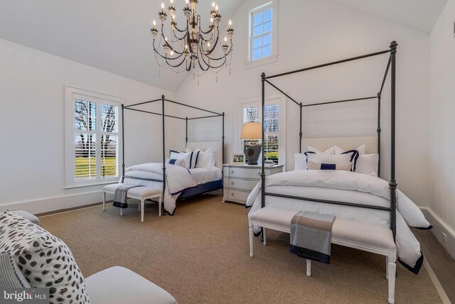 bedroom featuring high vaulted ceiling, a chandelier, baseboards, and carpet