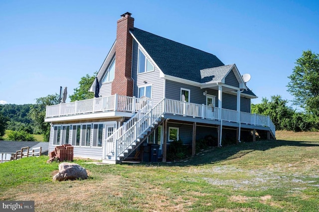 32 Old Hollow Rd, Sperryville, VA 22740 - rear view of property featuring a chimney, a yard, a shingled roof, stairway, and a wooden deck