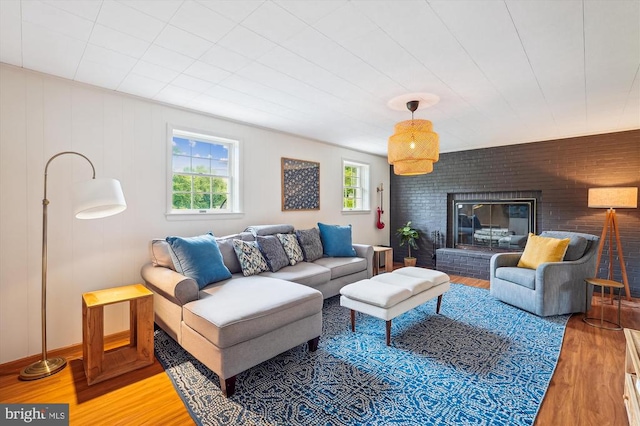  - living room featuring light wood-style flooring and a fireplace
